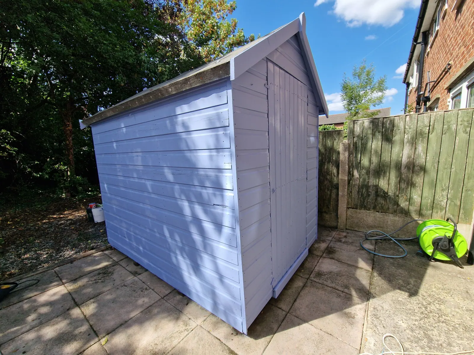 Garden shed freshly painted lilac